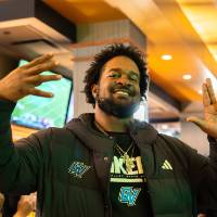 Gentleman posing for photo while giving the Anchor Up symbol